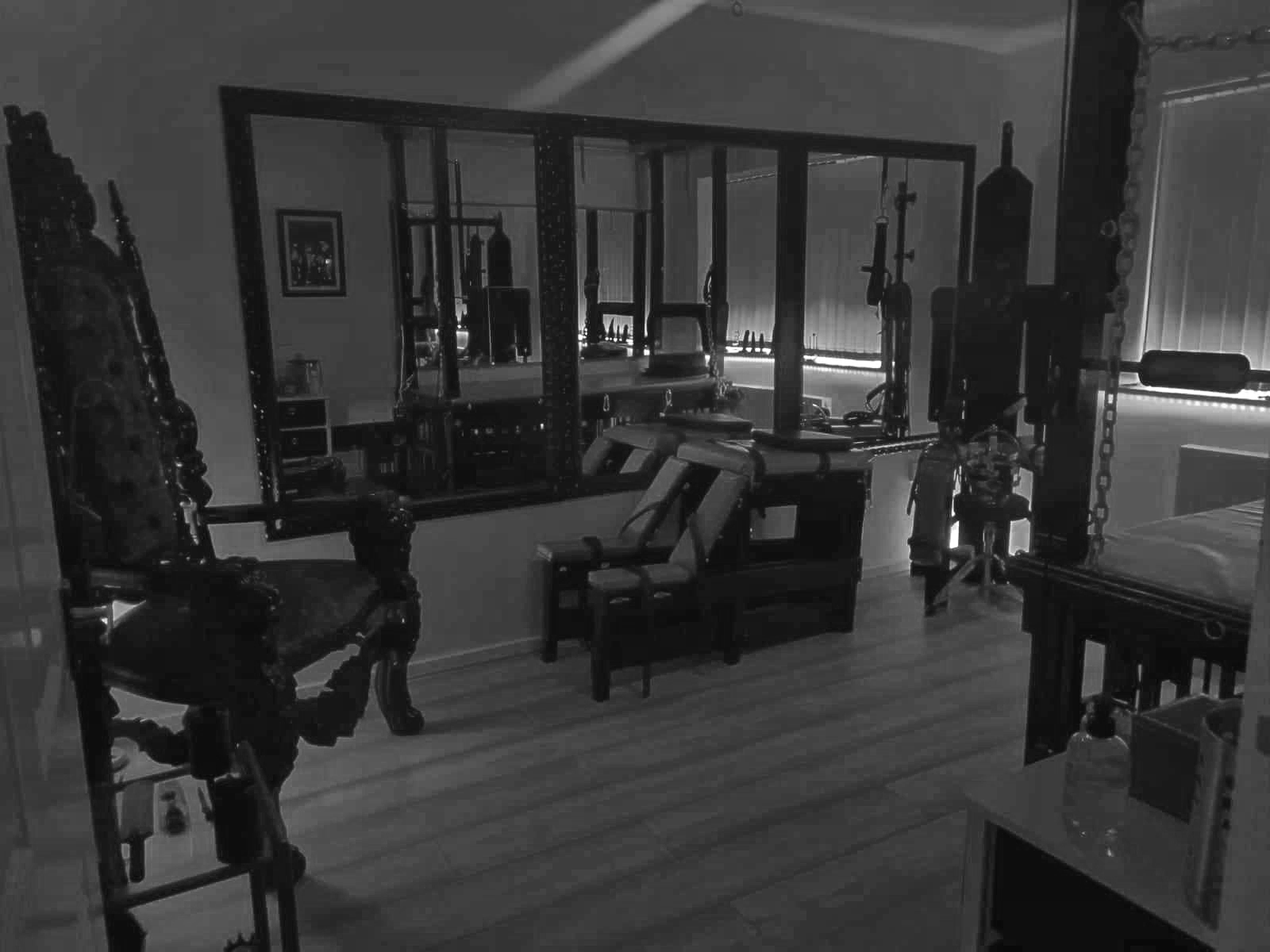 Lady Lucina's Dungeon with a chair, bed and BDSM apparatus